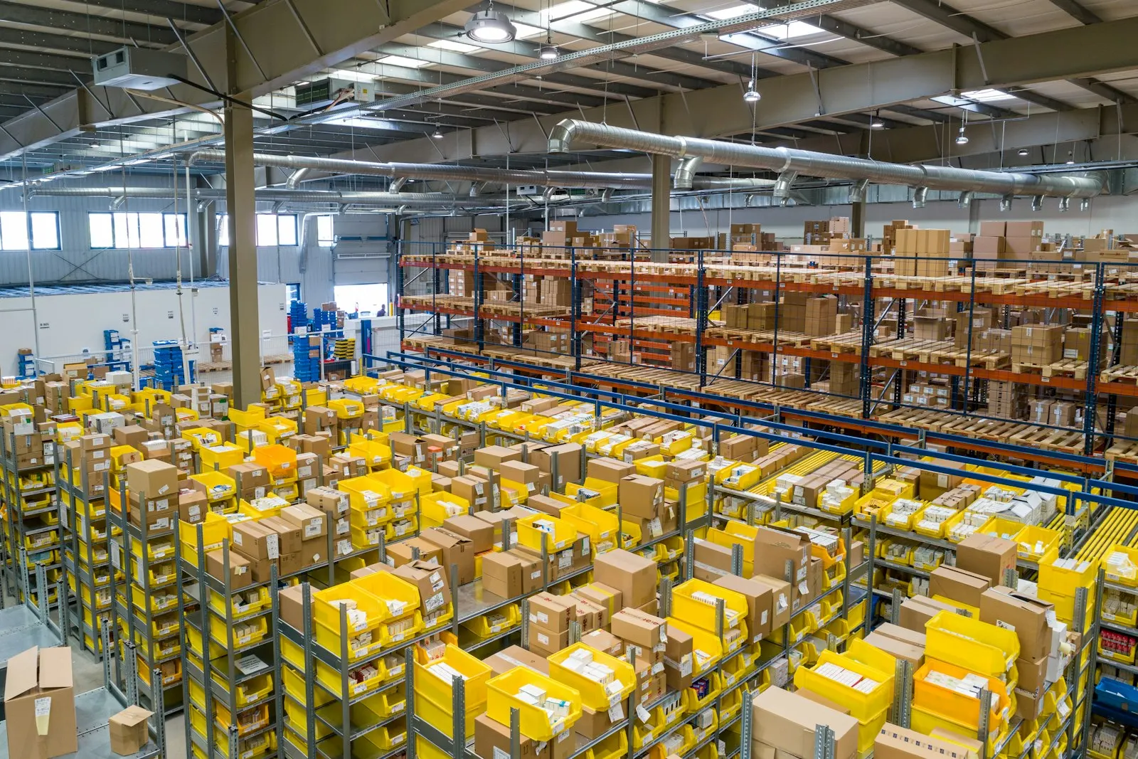 Warehouse aisles with shelves of boxed stock