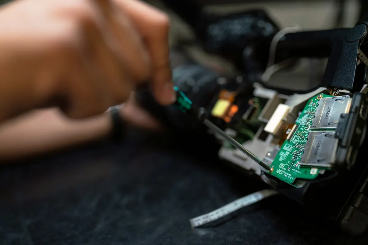 Technician inspecting a circuit board